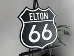Classic highway style 3D acrylic sign that says 'ELTON 66' in black and white