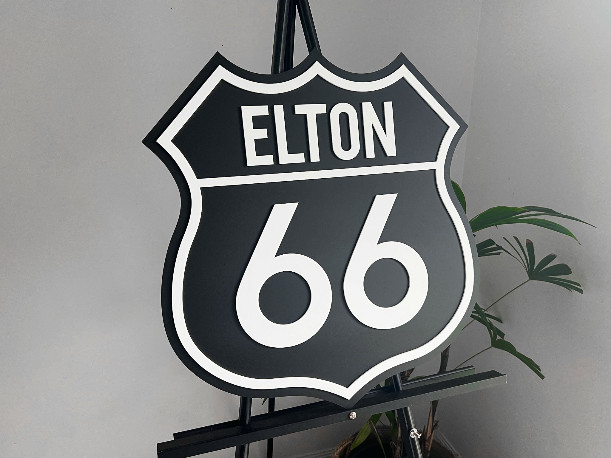 Classic highway style 3D acrylic sign that says 'ELTON 66' in black and white
