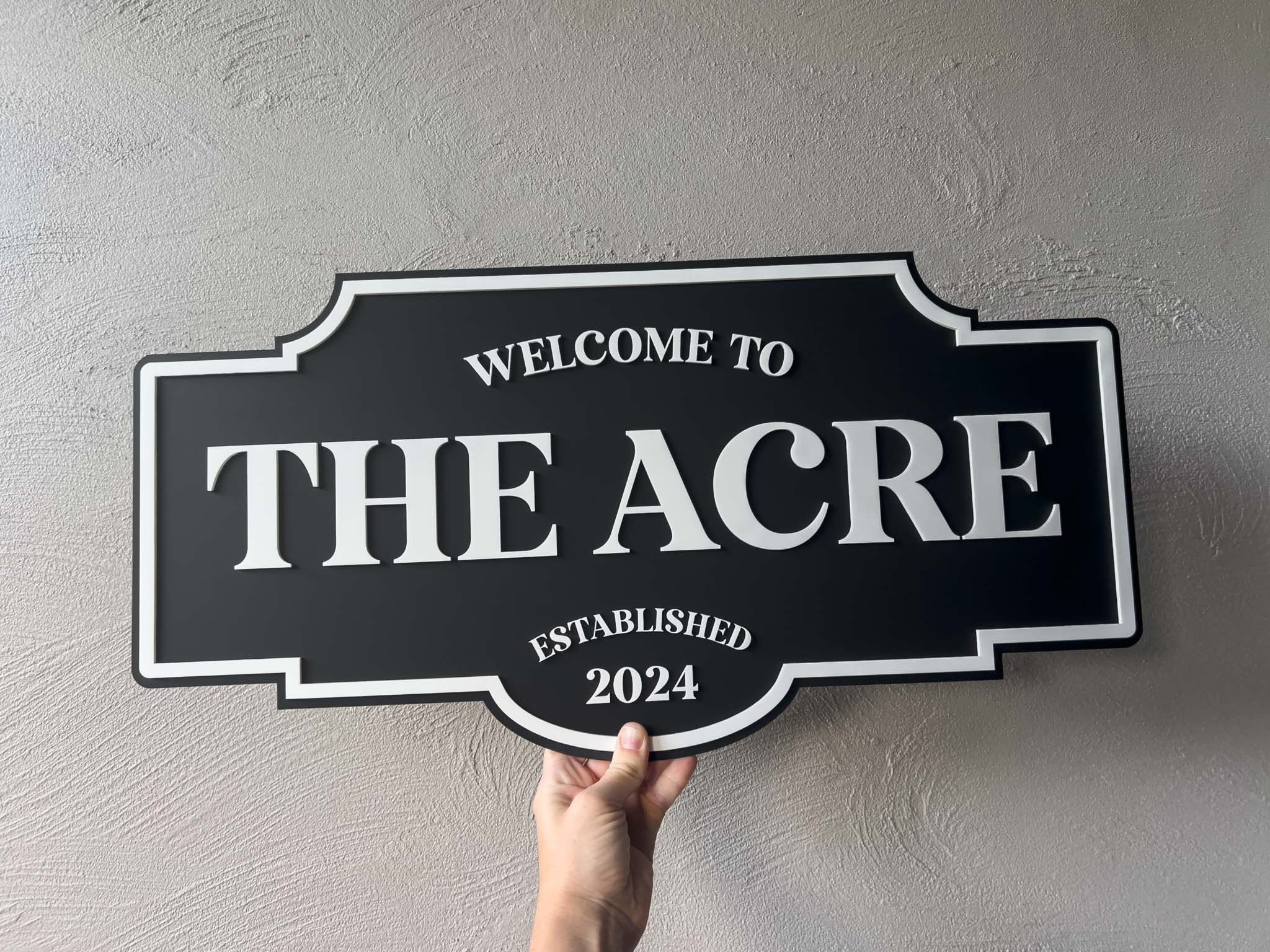 Custom 3D acrylic sign with 'Welcome To The Acre Established 2024' in black and white.