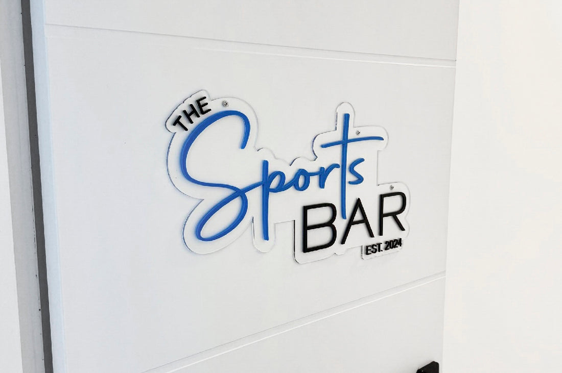 Acrylic 'The Sports Bar' door sign display on an entrance door