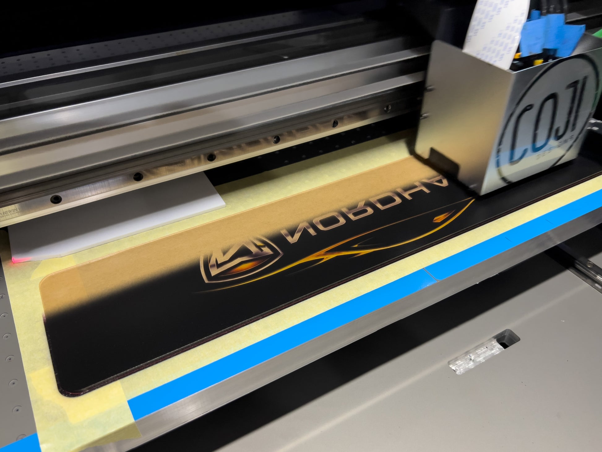 A Euro Cambridge logo plate being printed