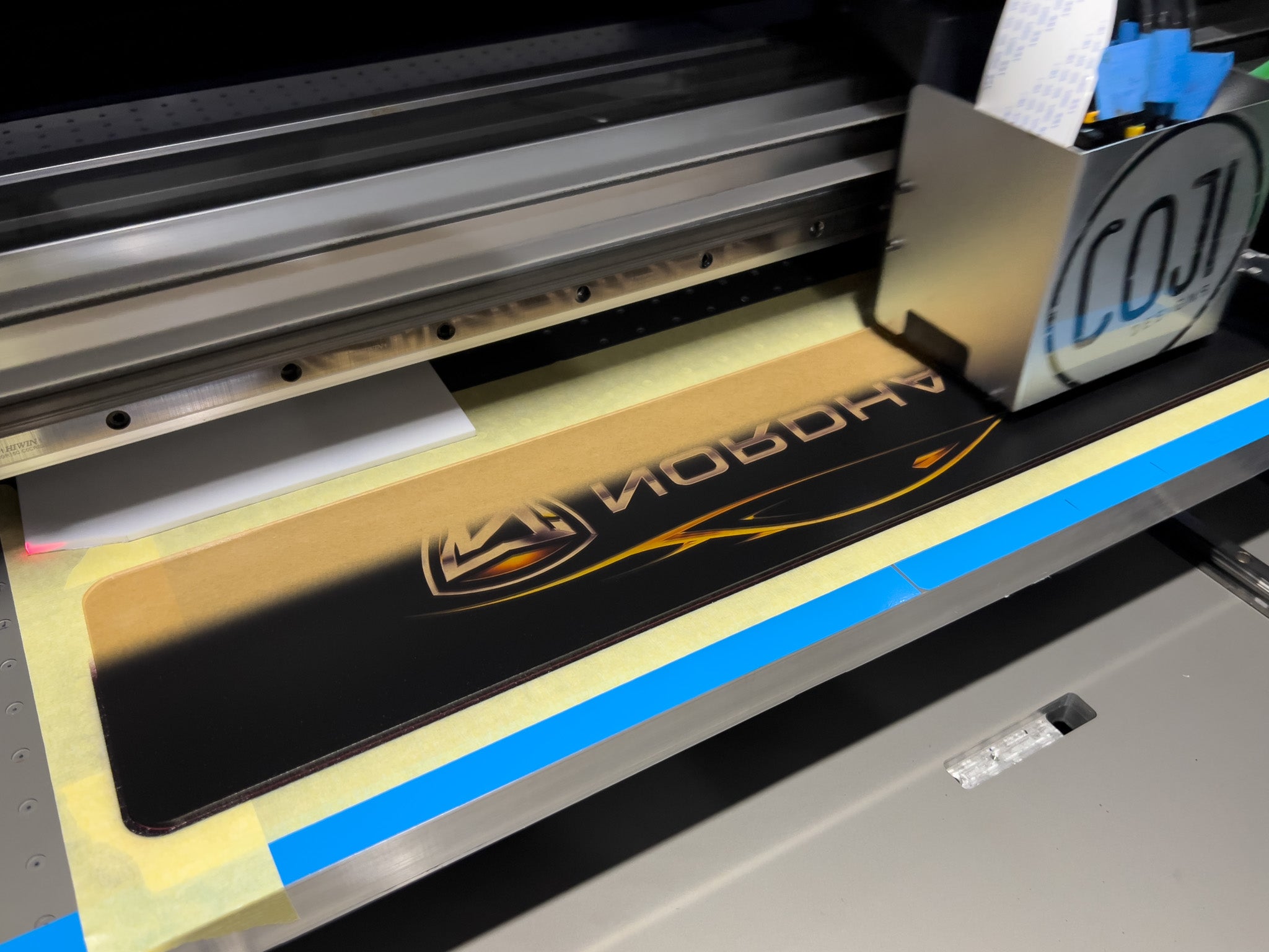 A Euro Cambridge logo plate being printed