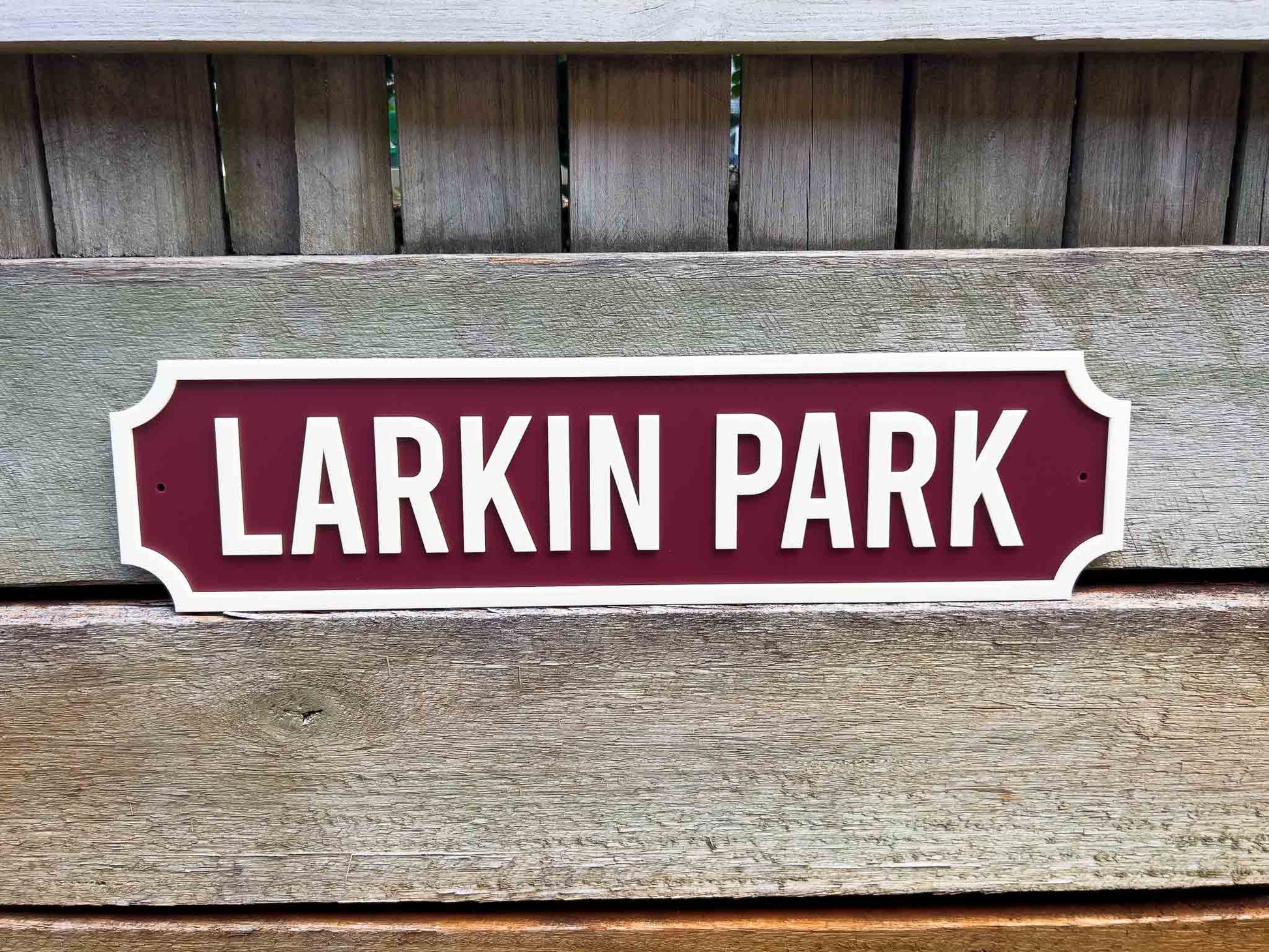 Custom vintage 3d acrylic street sign reading 'Larkin Park' on a wooden background