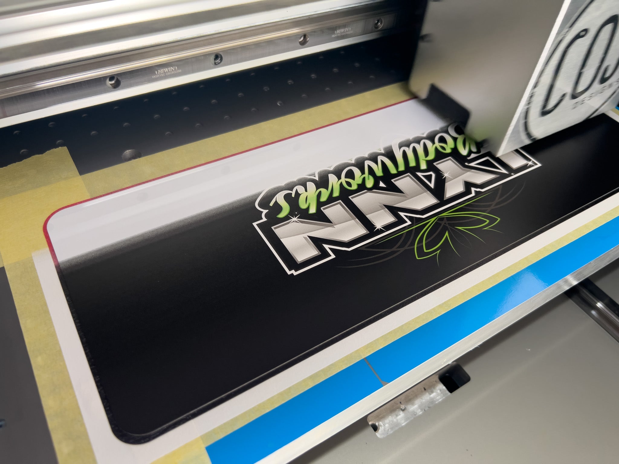 UV printer printing on an aluminium logo plate