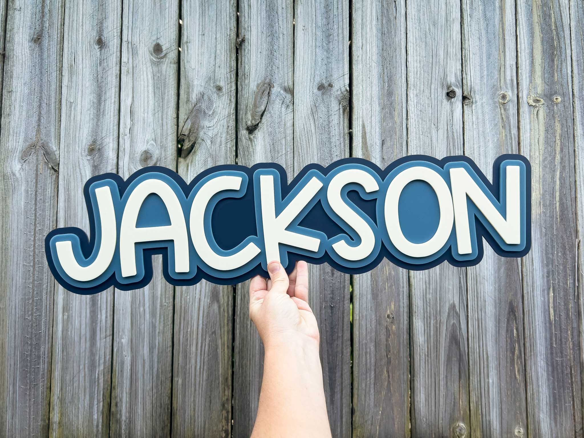Retro Beachy 3D Acrylic Wall lettering name in blue and beige that says 'JACKSON'.