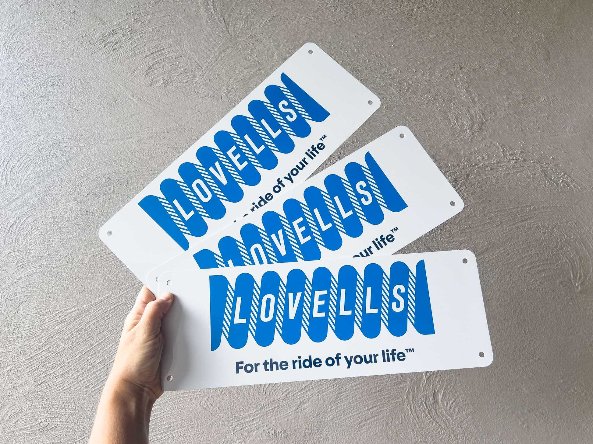 Three 'LOVELLS' branded logo cover plates