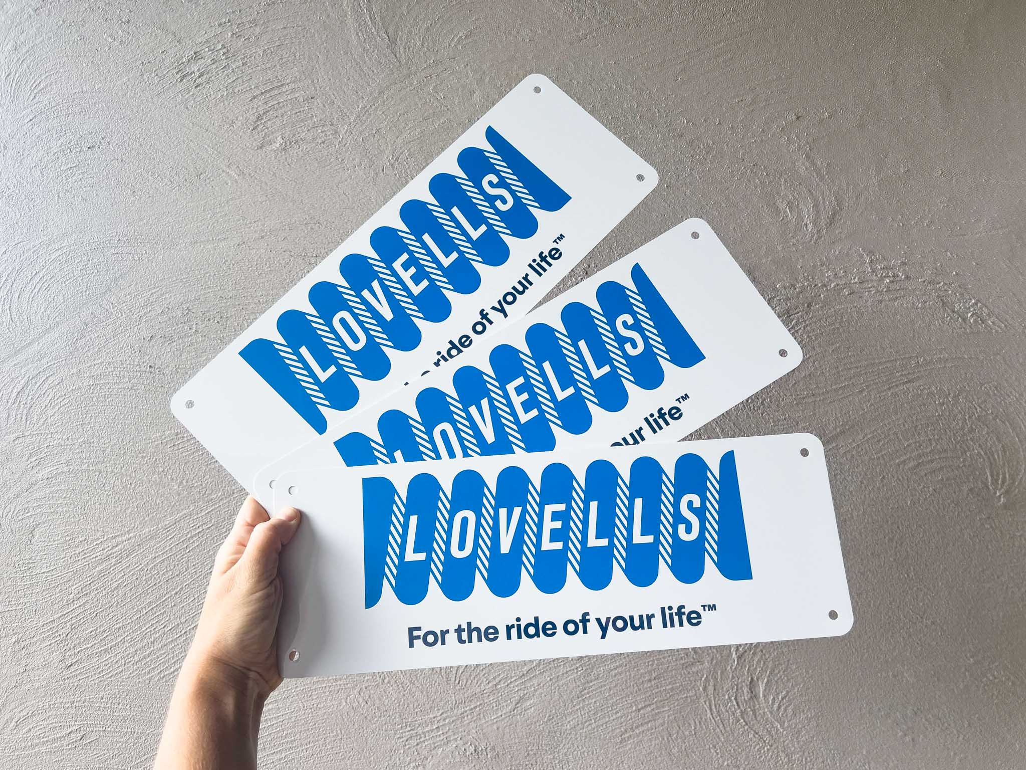 Three 'LOVELLS' branded logo cover plates