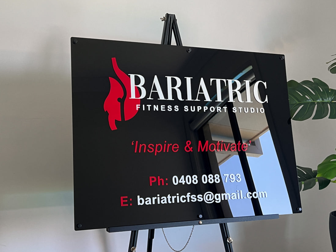 Custom branded 3D acrylic sign for Bariatric Fitness Support Studio in black, white and red.
