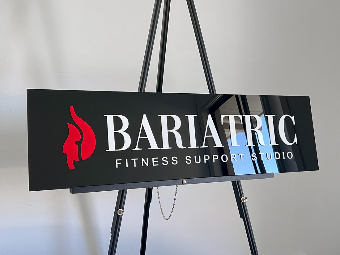 Rectangular 3D acrylic business sign for Bariatric Fitenss Support Studio in black, white and red.