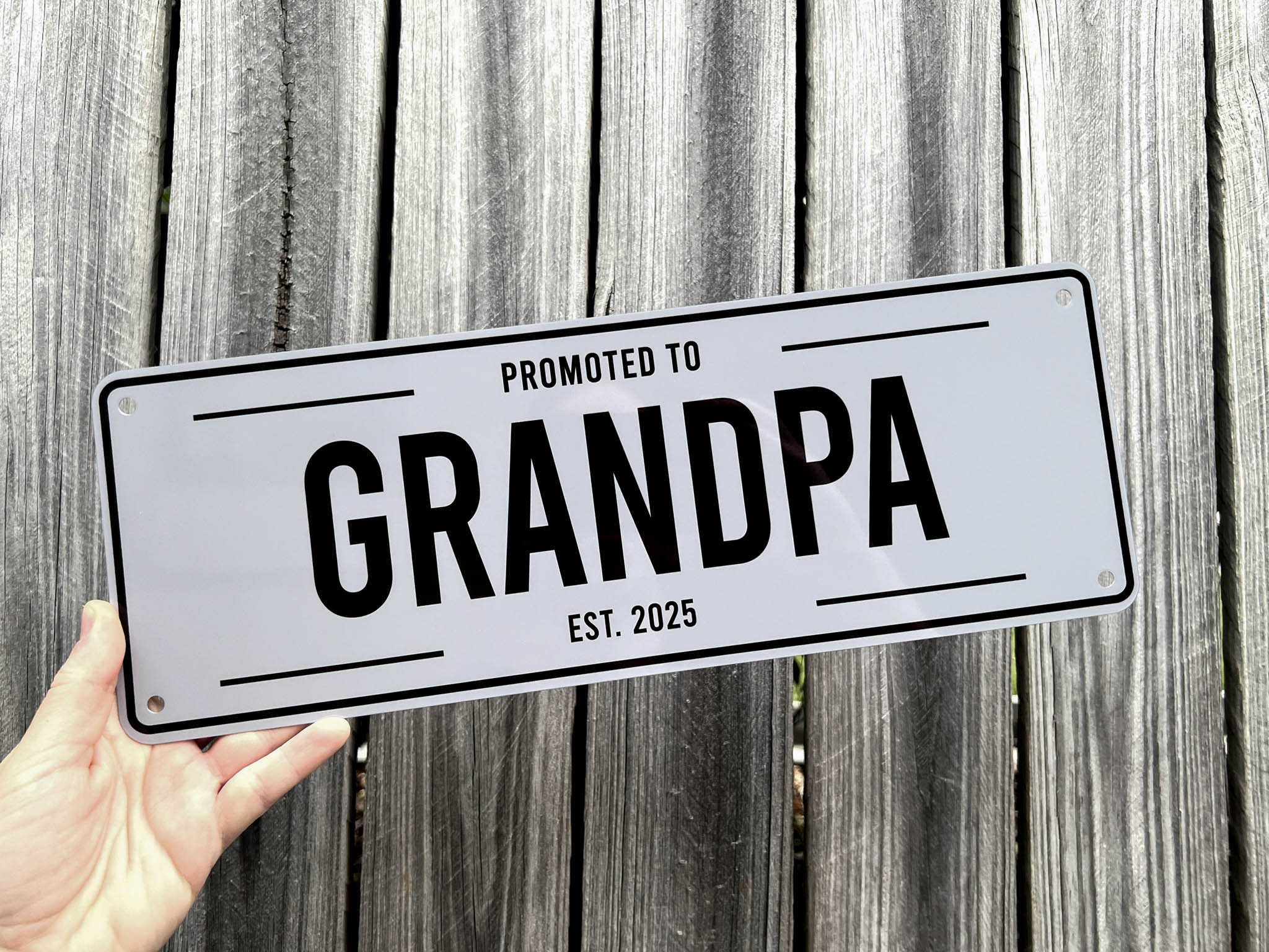 Custom printed grey and black sign that reads 'Promoted To Grandpa Est. 2025'.
