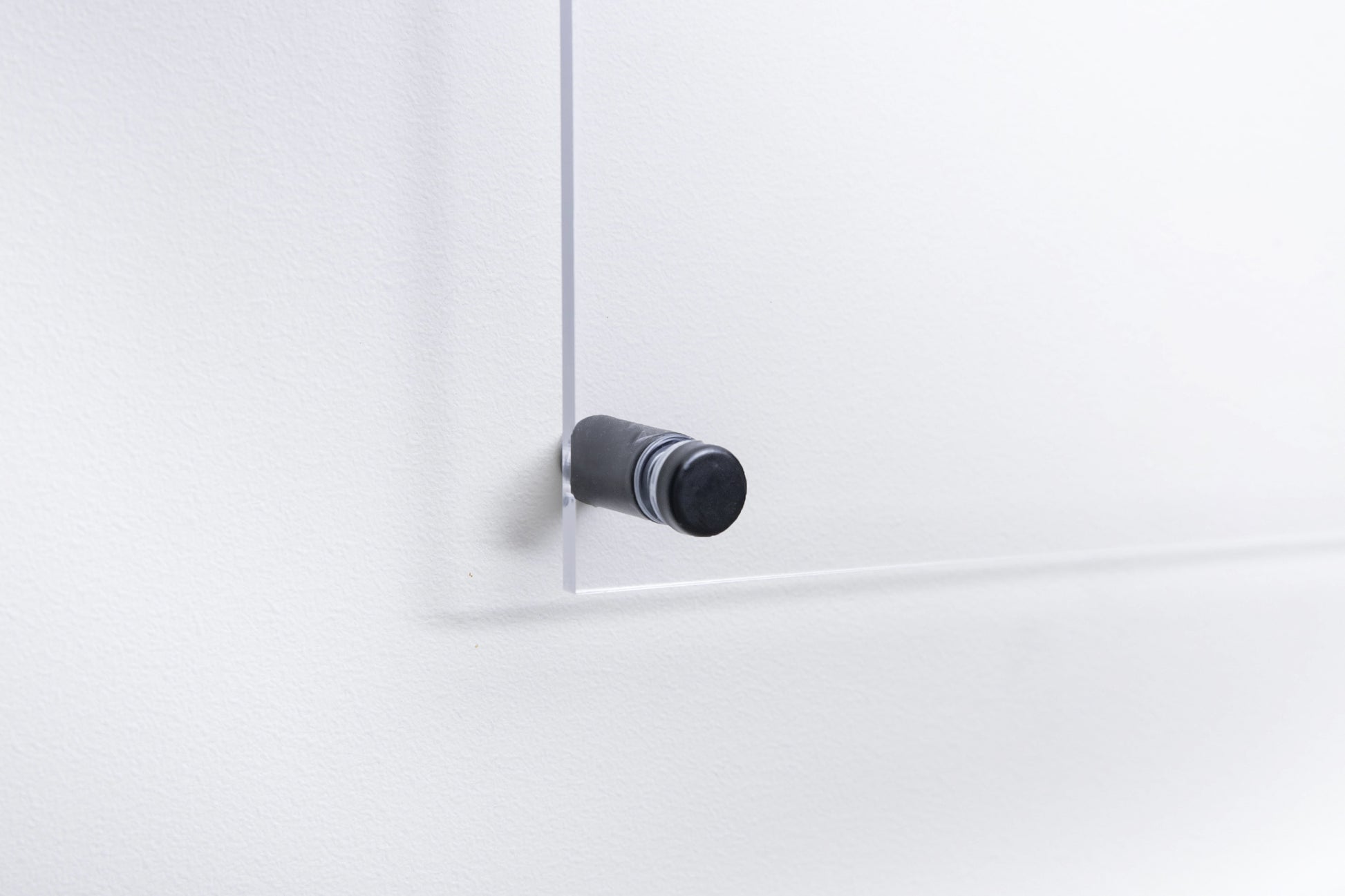 Close up of a clear acrylic calendar wall mount