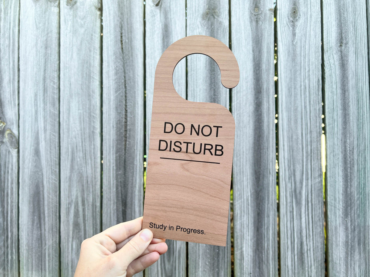 A Customer UV printed door hanger that reads 'DO NOT DISTURB. Study in Progress'.